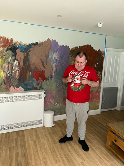 Max, who is autistic and non-verbal, has found solace and a nurturing environment at Kisimul, where he has developed a passion for painting