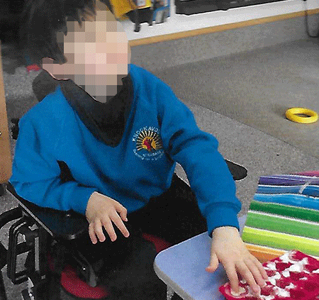 A mother has removed her autistic son from a school where she alleges he was restrained in a chair “like an animal” and reported the matter to the police. 